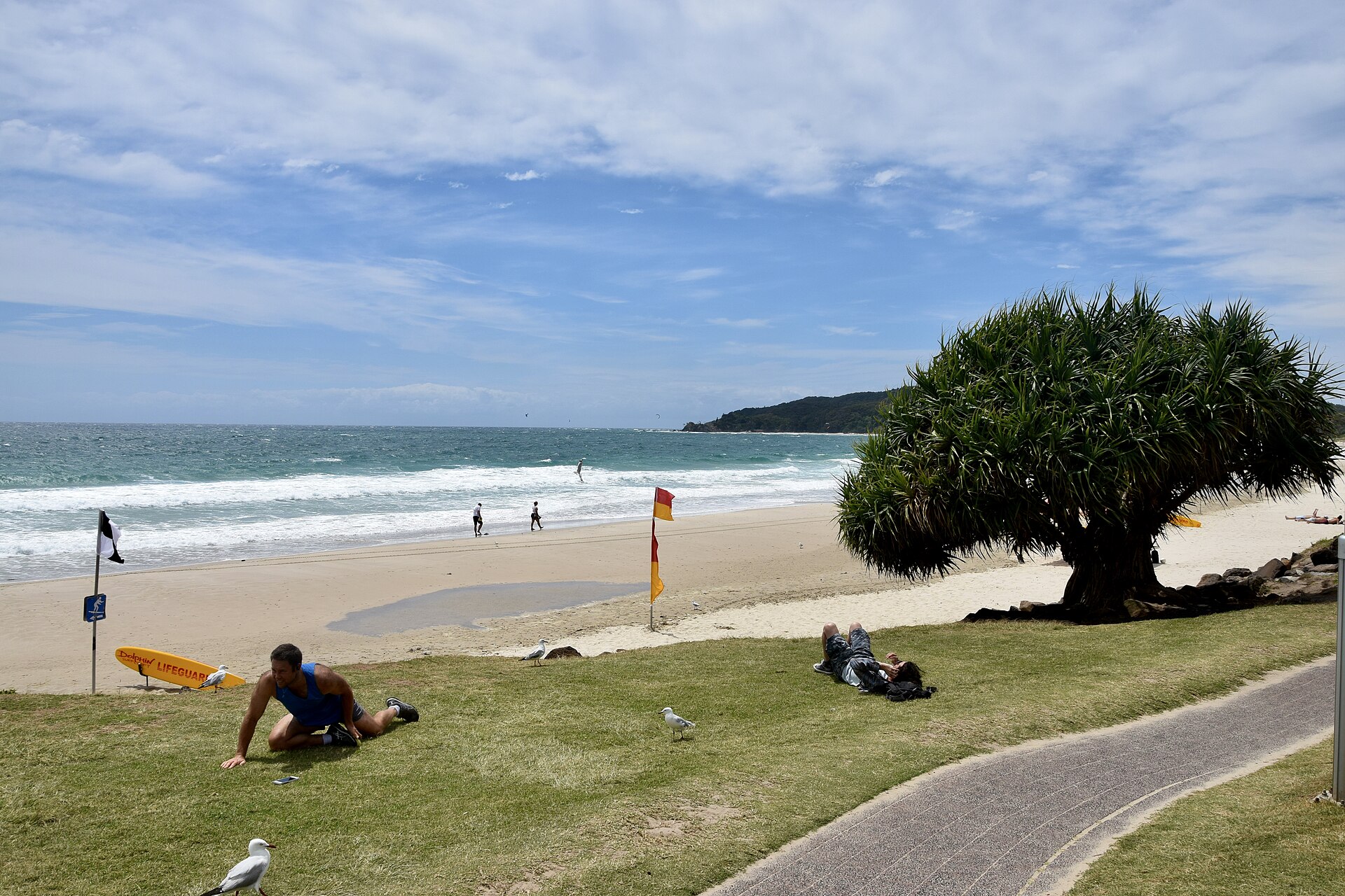 Main Beach in Byron Bay with Cape Byron in the background in the state of New South Wales, Australia.